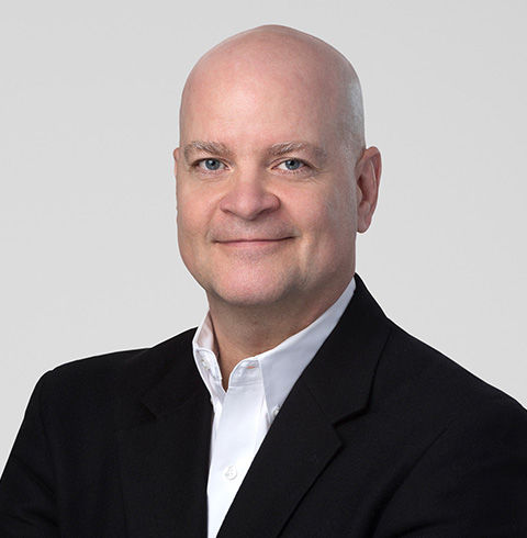 A headshot of John Devlin.