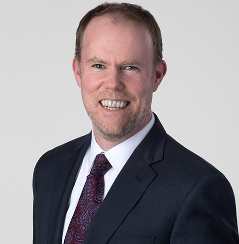 A headshot of Gregory Fox.