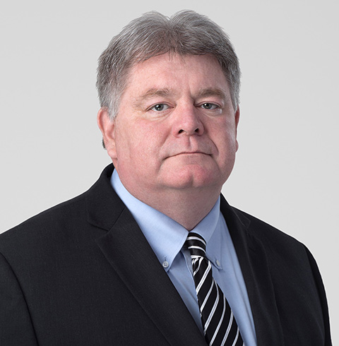 A headshot of Charles Huber.