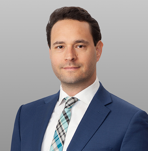 A headshot of Ezra Hammer.