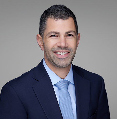 A headshot of Adam Maarec.