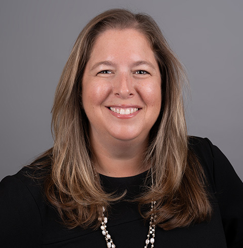 A headshot of Jenna Millman.