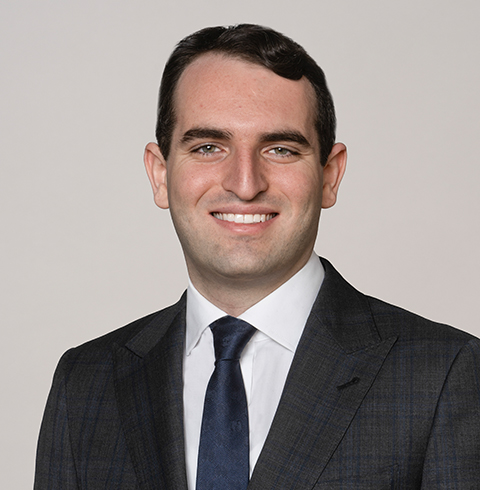 A headshot of Manny Marcos.