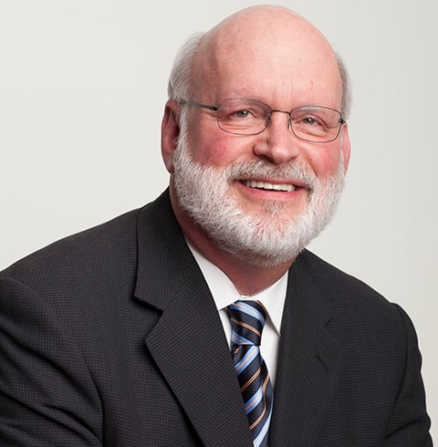 A headshot of Bill Needle.