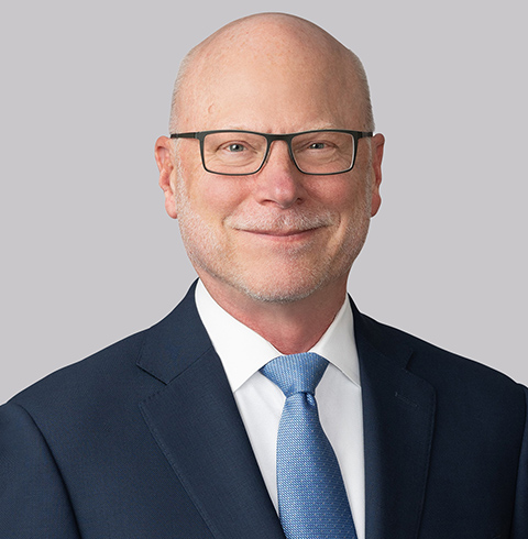 A headshot of Charles Riley.