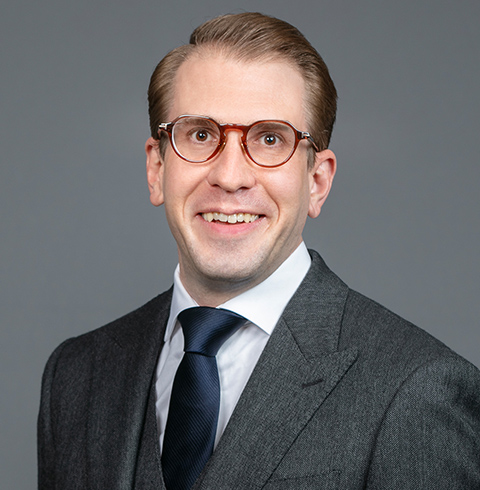 A headshot of Joseph Schuster.