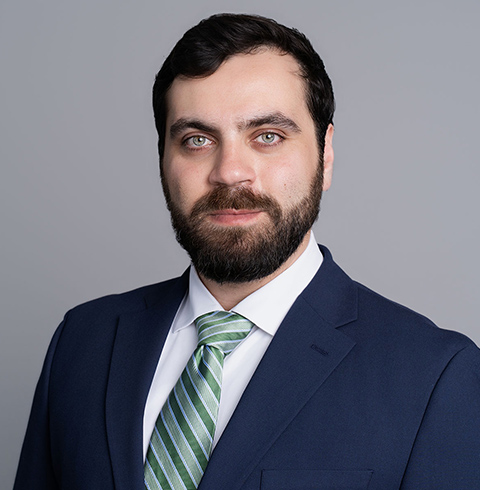 A headshot of Deniz Tunceli.